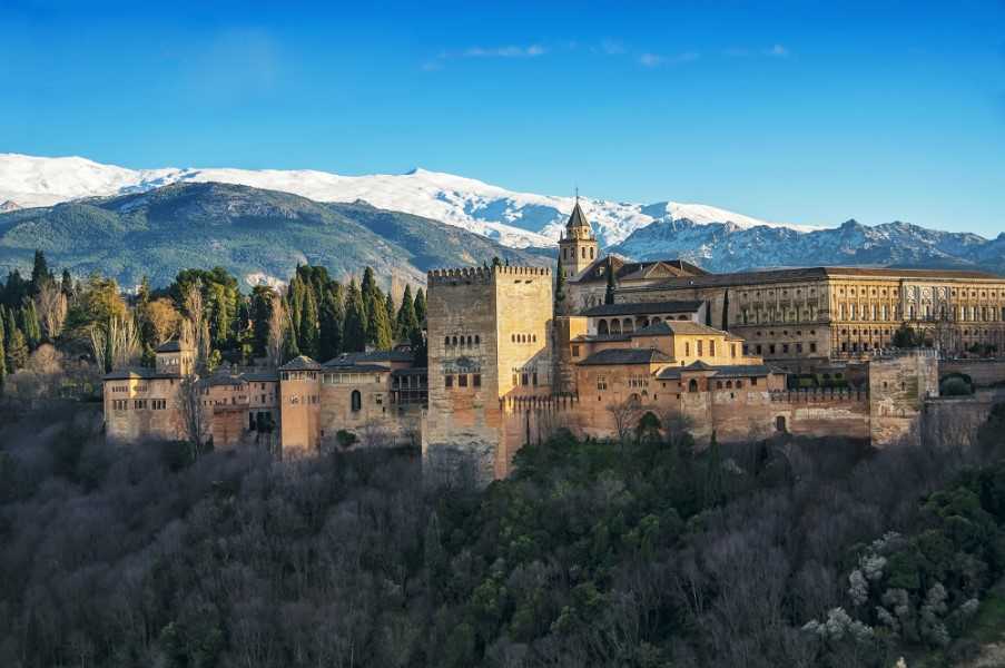 Alhambra Palace with a backdrop of the Sierra Nevada mountain range, Andalucia, Spain