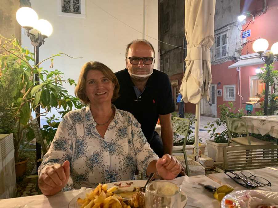 Julia, our representative on Corfu. Note the clear mask worn by the taverna employee