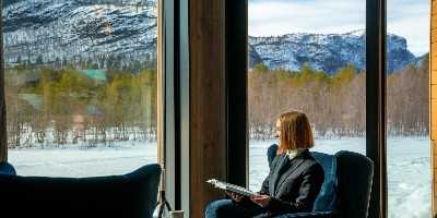 River Room Reading Sorrisniva, Sorrisniva Arctic Wilderness Lodge, Alta, Northern Norway, Norway