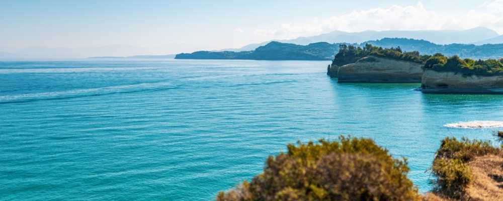 boats-sailing-on-sea-near-corfu-island-under-blue