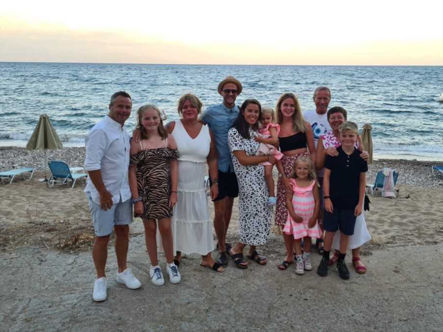 Lesley and Steve and their family on the beach below the Ilaira Apartments, Chrani