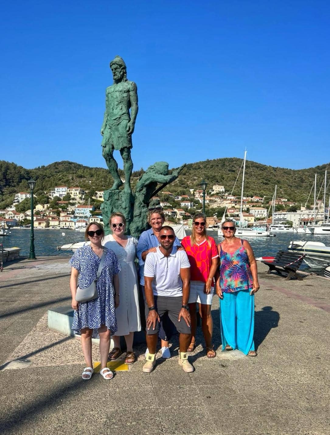 Sunvil local team with Vathy statue, Ithaca